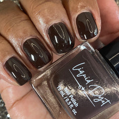 Picture of fingernails painted in a chocolate colored non toxic vegan nail polish