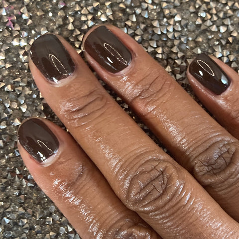 Image of Picture of fingernails painted in a chocolate colored non toxic vegan nail polish